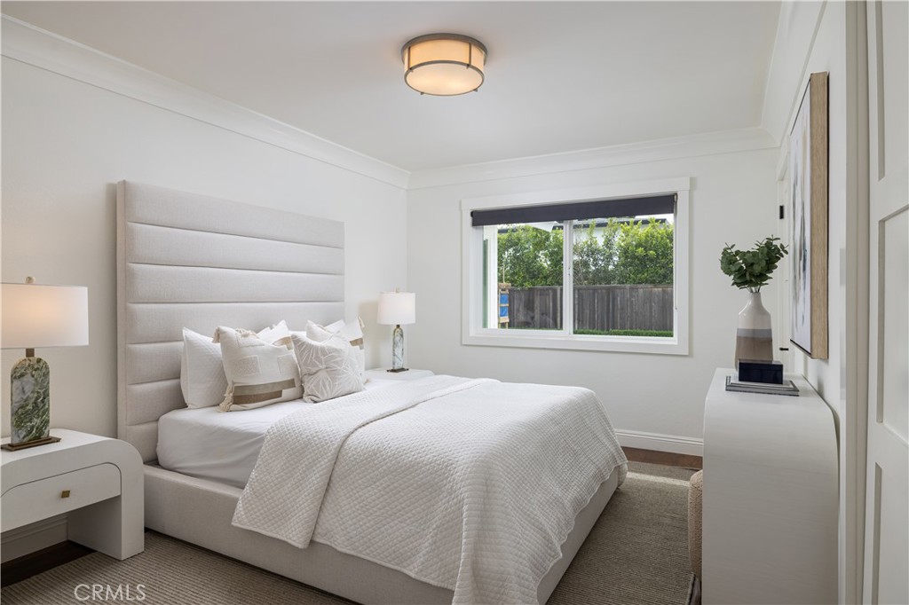 1609 Ruth Lane Newport Beach, CA 92660 - Photo 15 of 39 a bedroom with a bed and a window