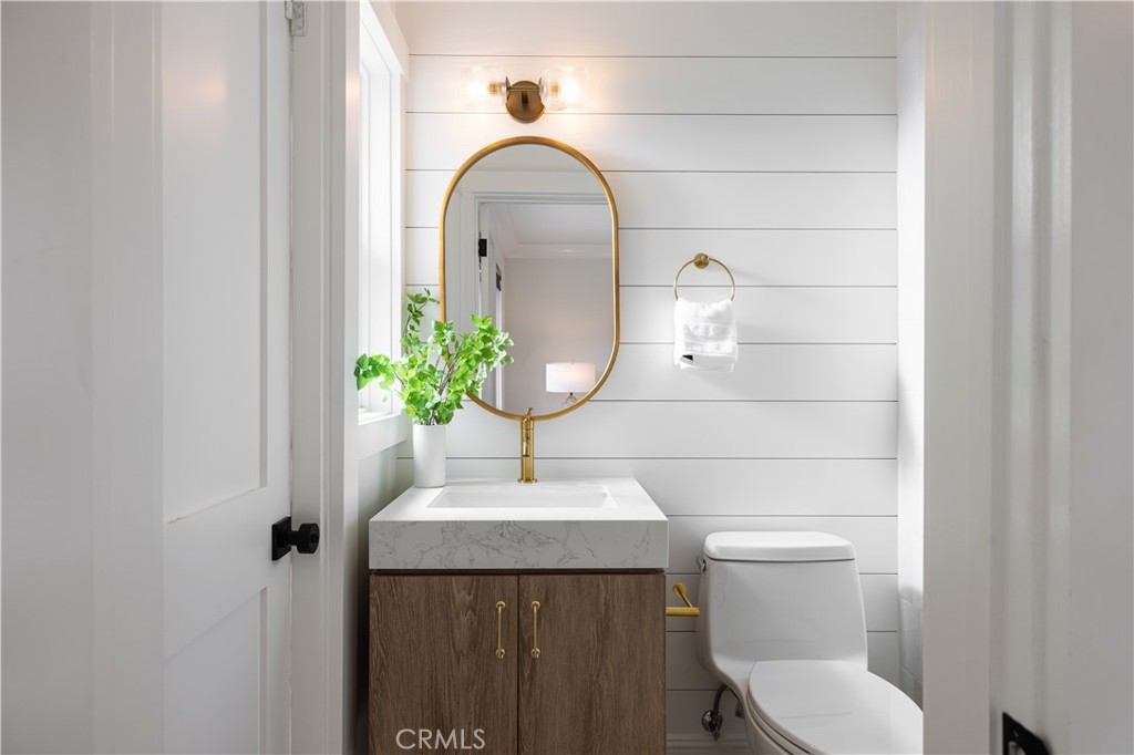 1609 Ruth Lane Newport Beach, CA 92660 - Photo 17 of 39 a bathroom with a toilet sink and mirror
