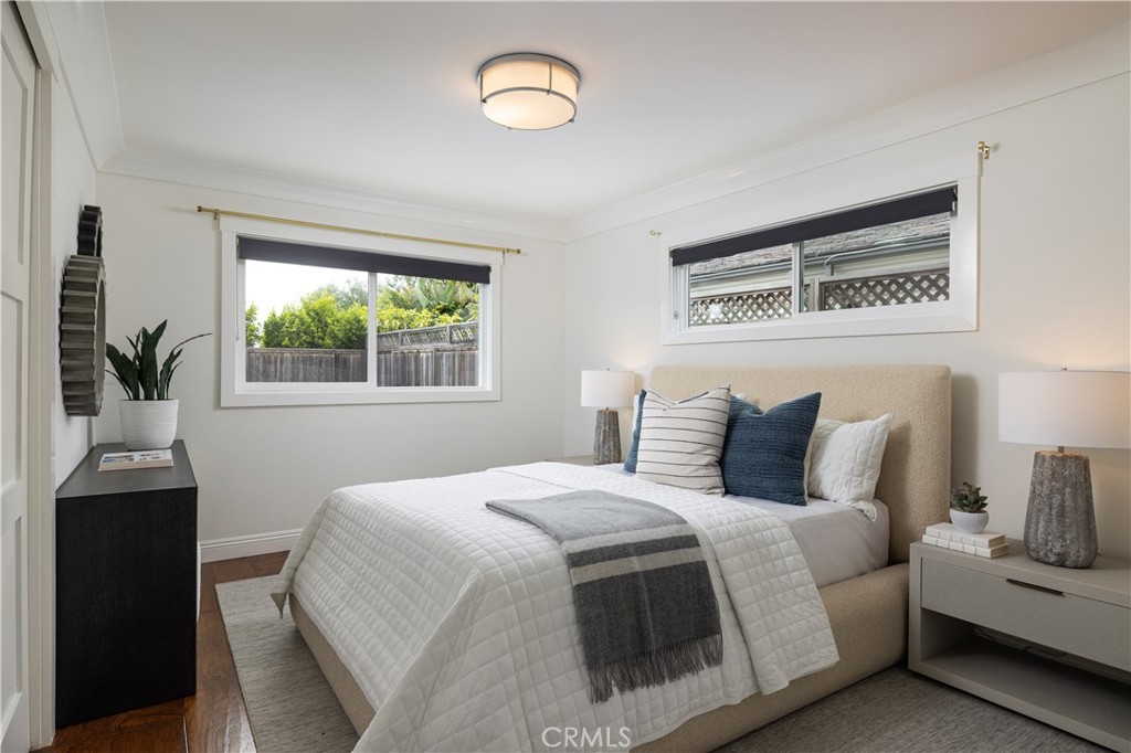 1609 Ruth Lane Newport Beach, CA 92660 - Photo 18 of 39 a bedroom with a bed and a table