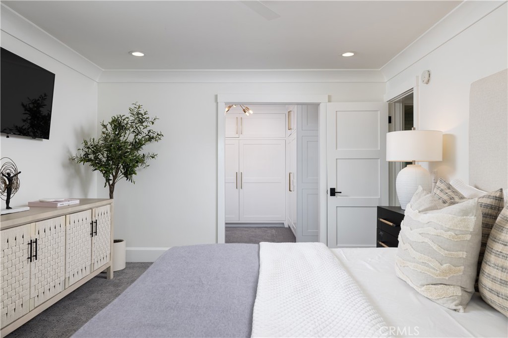 1609 Ruth Lane Newport Beach, CA 92660 - Photo 23 of 39 a bedroom with a bed and a potted plant