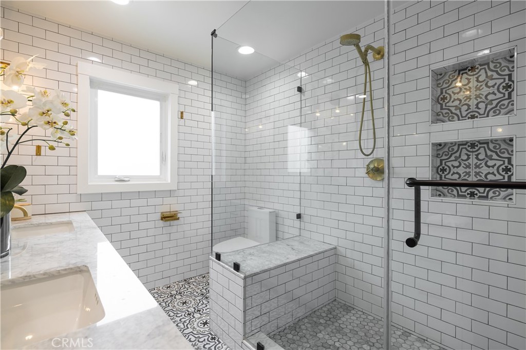 1609 Ruth Lane Newport Beach, CA 92660 - Photo 26 of 39 a bathroom with a shower a sink and a shower