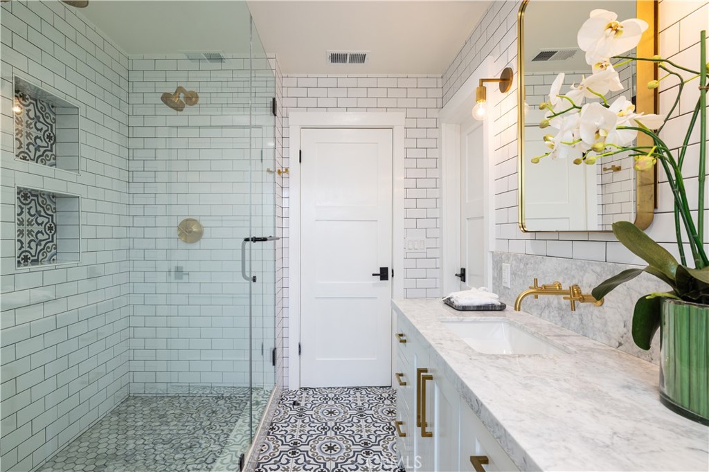 1609 Ruth Lane Newport Beach, CA 92660 - Photo 27 of 39 a bathroom with a granite countertop sink a toilet and shower