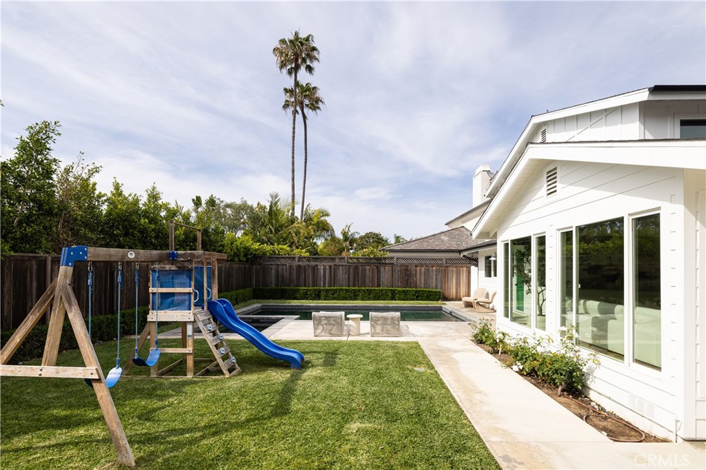 1609 Ruth Lane Newport Beach, CA 92660 - Photo 32 of 39 a view of a house with swimming pool and deck