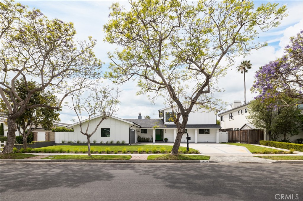 1609 Ruth Lane Newport Beach, CA 92660 - Photo 37 of 39 a house with trees in the background