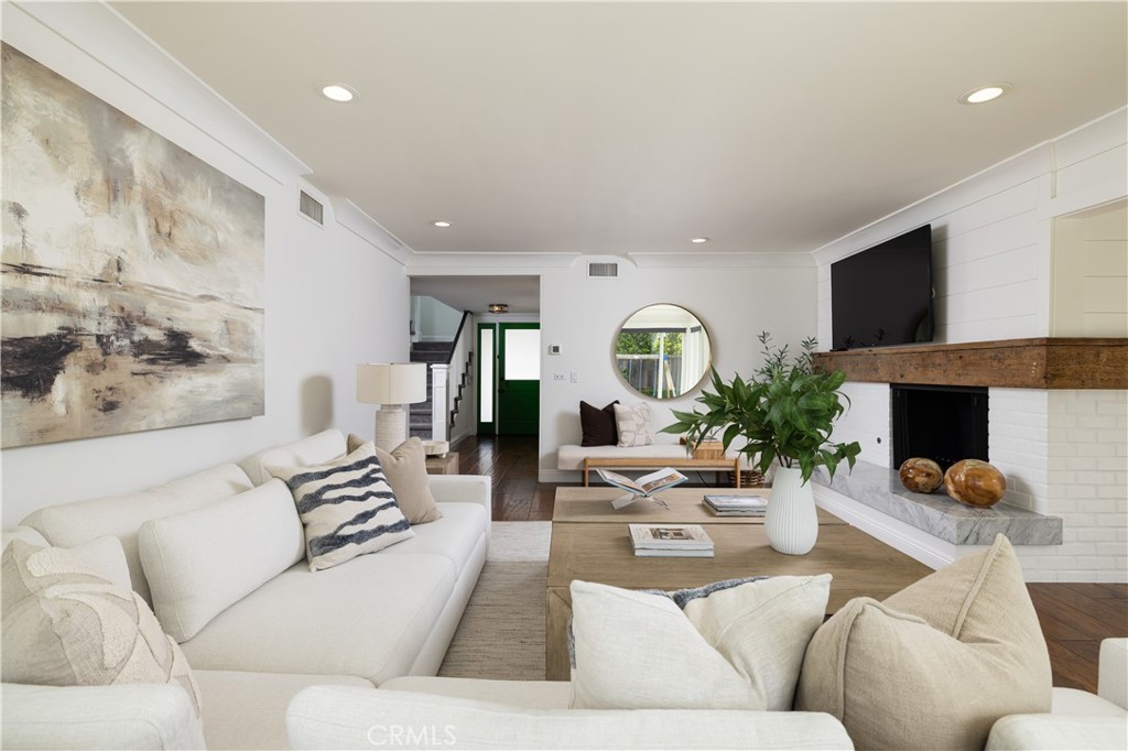 1609 Ruth Lane Newport Beach, CA 92660 - Photo 7 of 39 a living room with furniture and a fireplace
