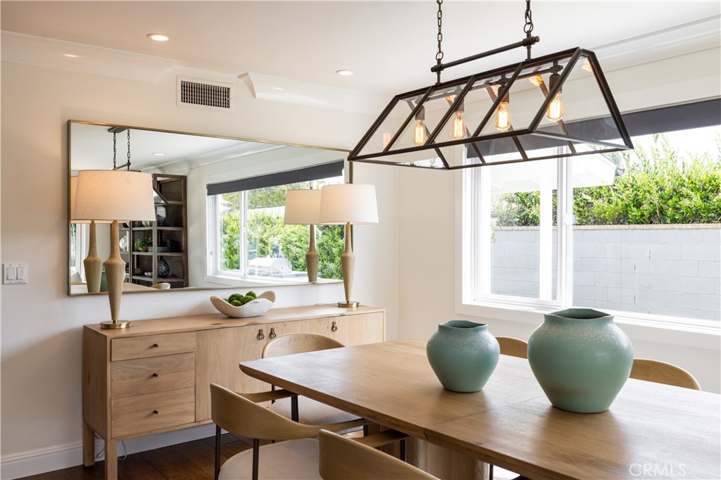 1609 Ruth Lane Newport Beach, CA 92660 - Photo 9 of 39 a kitchen with a table a sink and cabinets