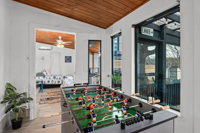 a spacious bedroom with a bed and a large window