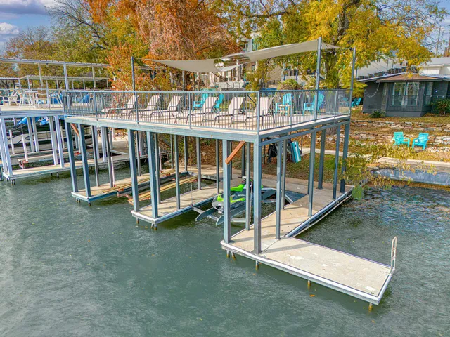 a view of a swimming pool with a deck
