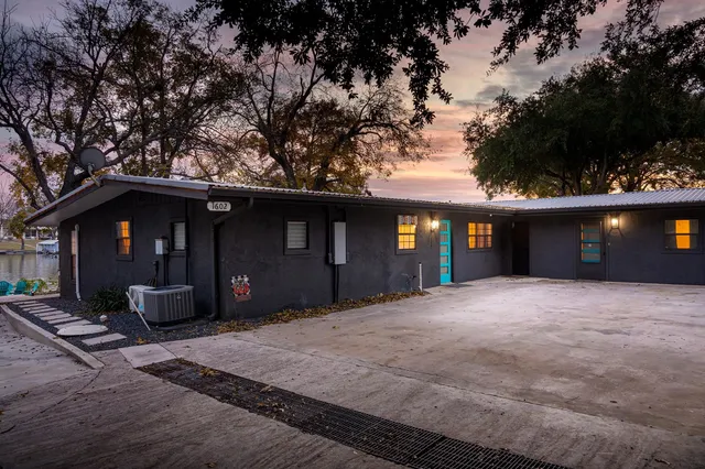 a view of a balcony with wooden floor and lake view