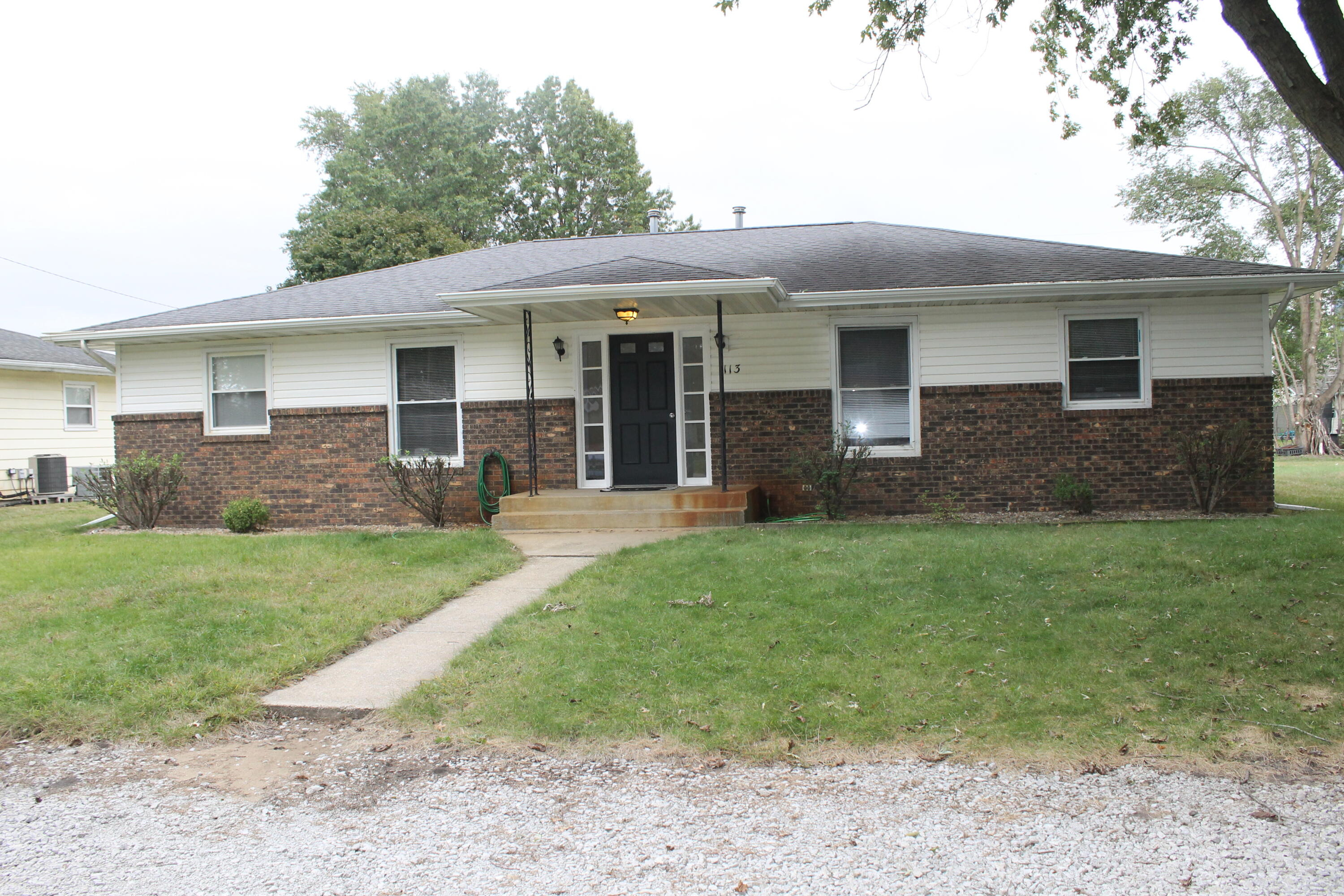 1113 Carnation Street Southeast De Motte, IN 46310 - Photo 1 of 7 a front view of house with yard and green space