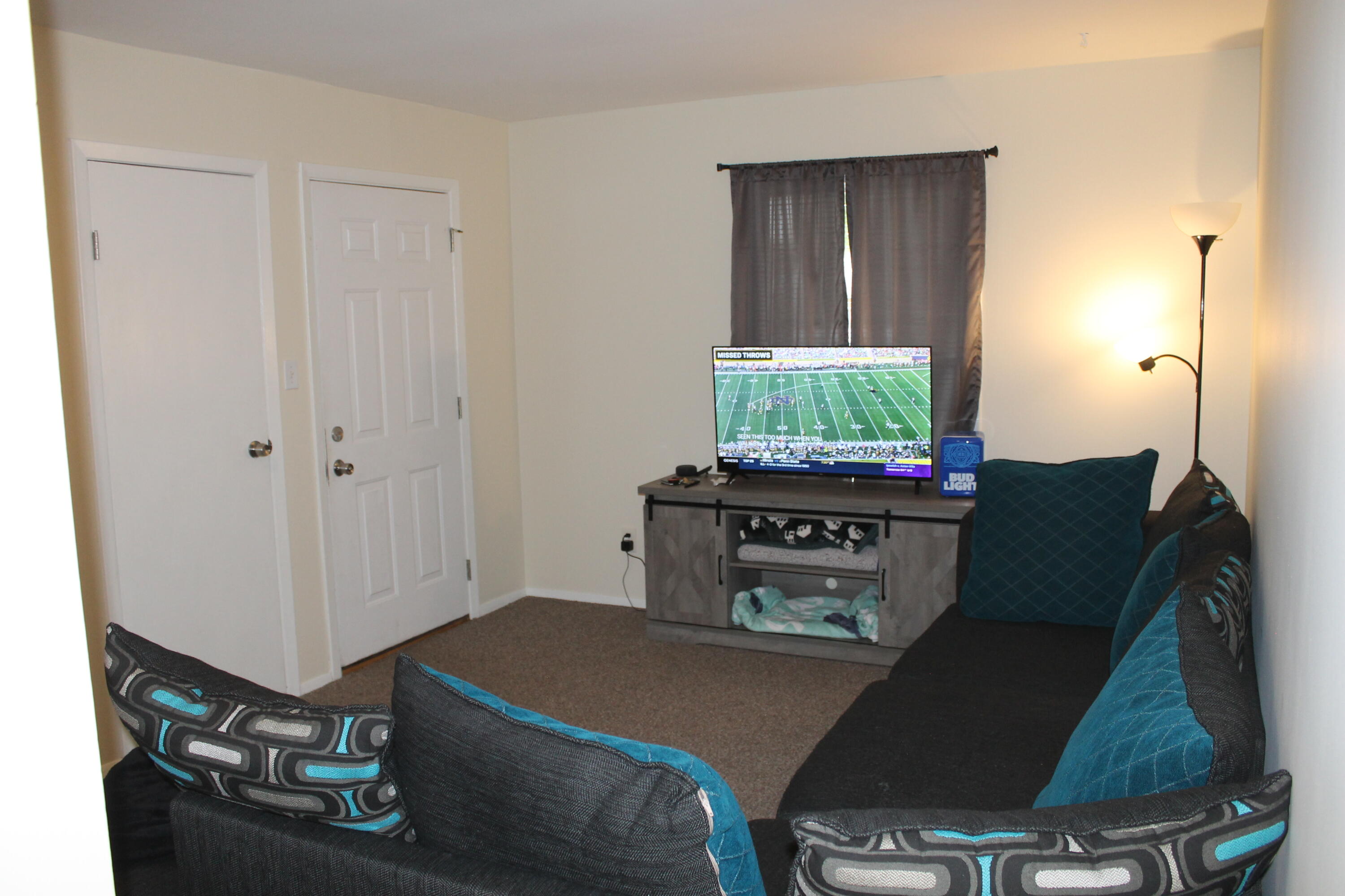 1113 Carnation Street Southeast De Motte, IN 46310 - Photo 3 of 7 a living room with a bed furniture and a window
