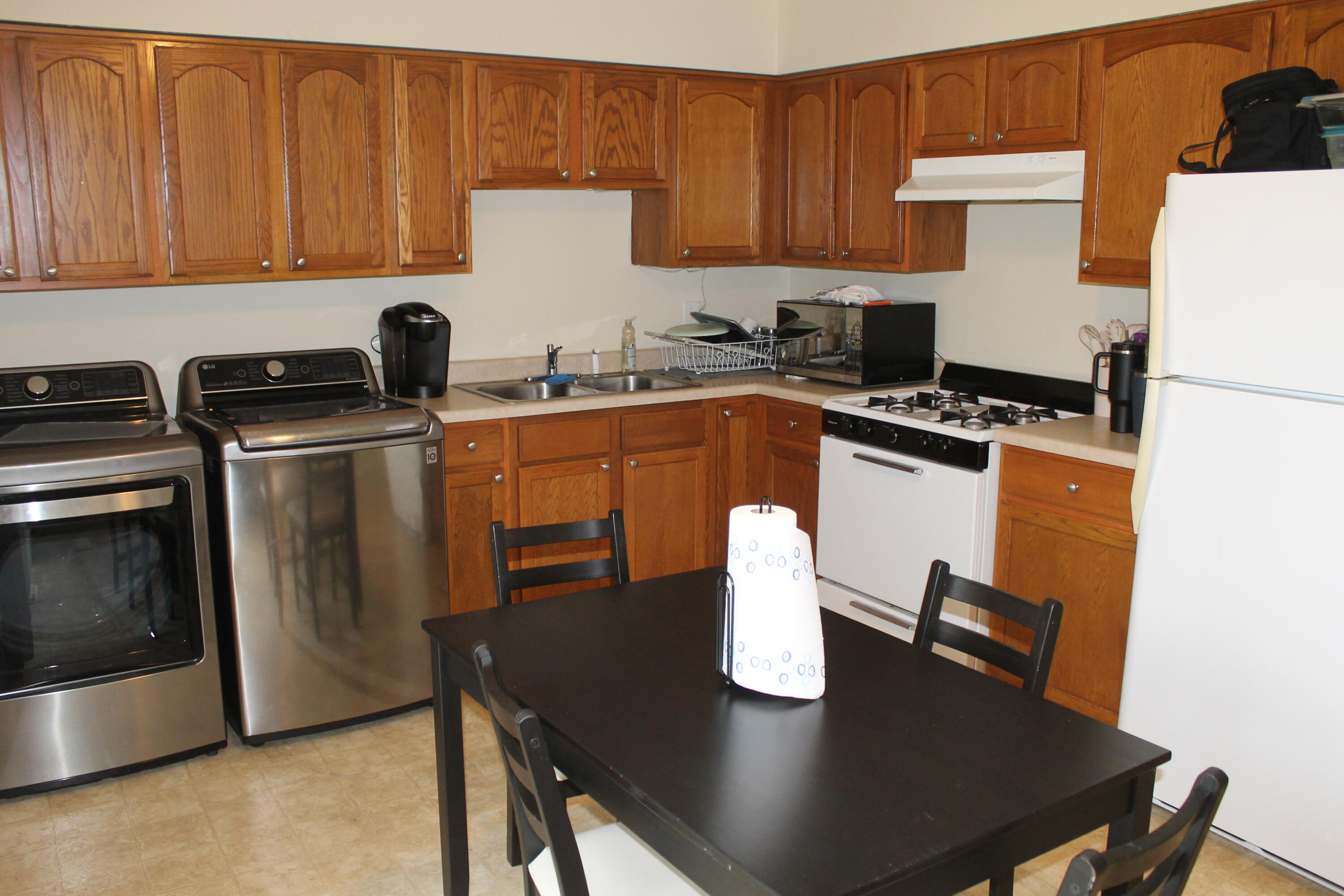 1113 Carnation Street Southeast De Motte, IN 46310 - Photo 7 of 7 a kitchen with a appliances a stove a microwave and a refrigerator