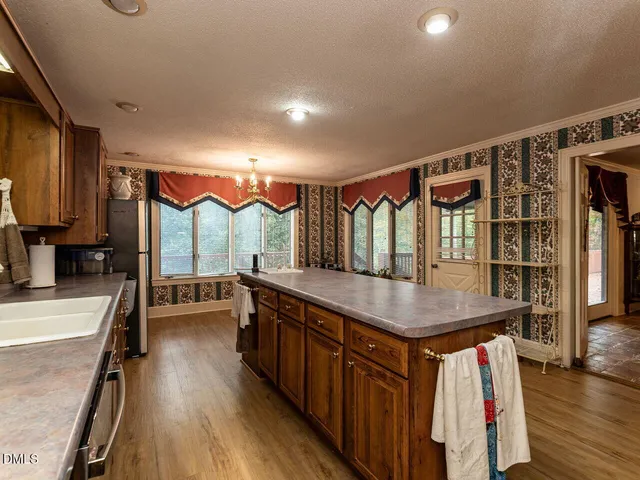 a bedroom with a bed couch and a window