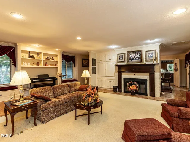 a bedroom with a bed and a bookshelf