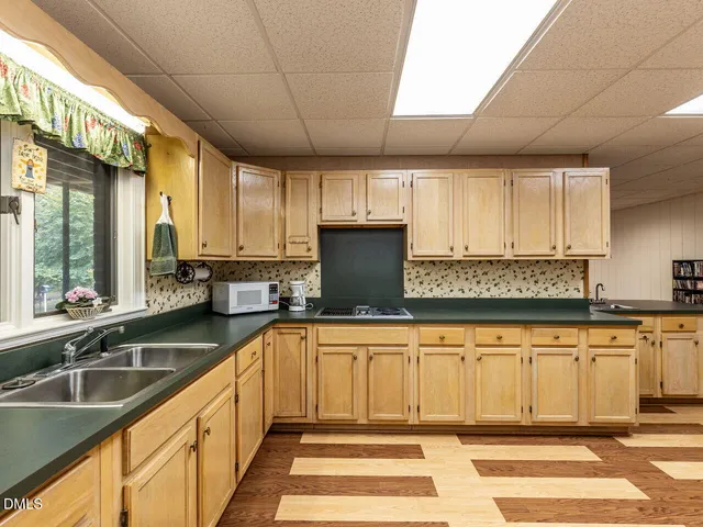 a view of yard with swimming pool