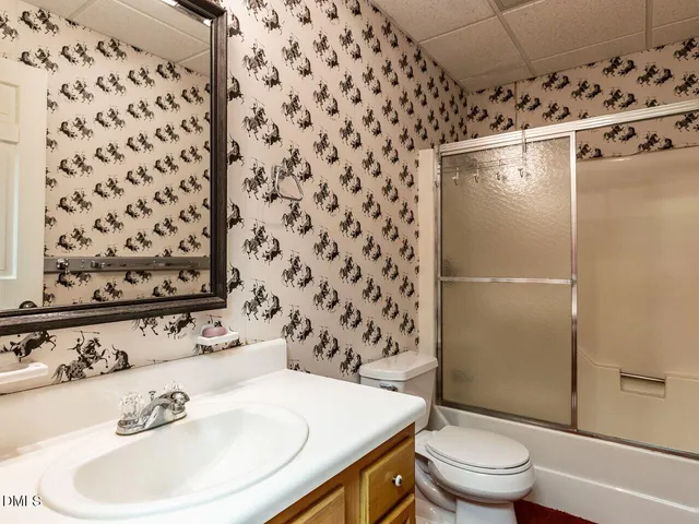 a view of a house with a yard and garden