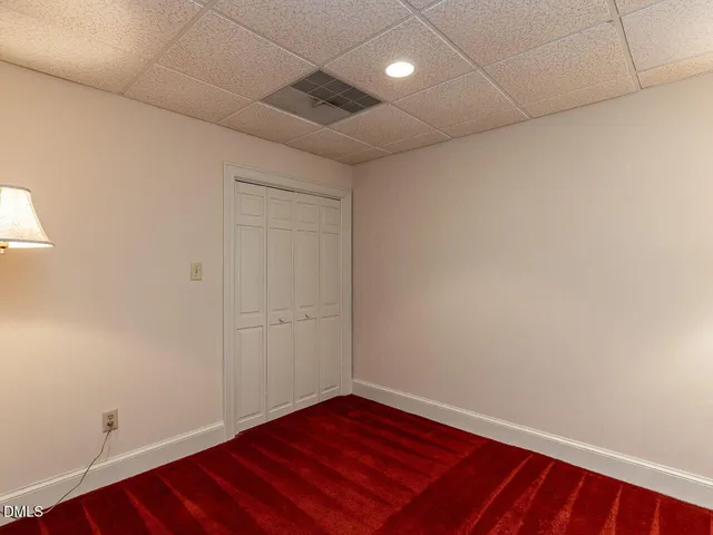 an aerial view of residential houses with outdoor space and lake view