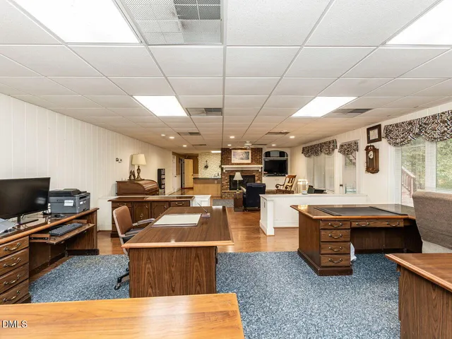 an aerial view of a house with a yard swimming pool and outdoor seating