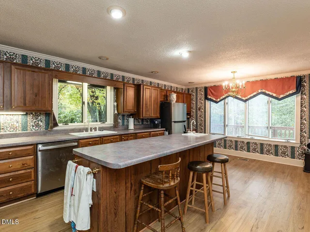a living room with furniture and a lamp