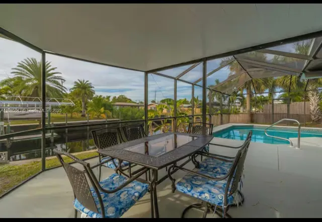 a view of a swimming pool with a patio