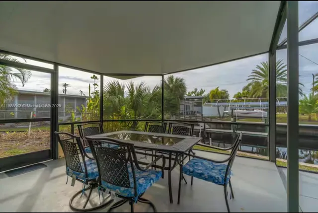 a patio with water view fountain and a potted plant