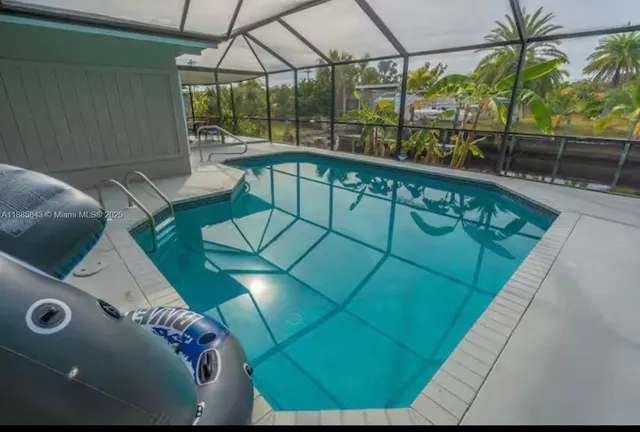 a view of a living room and floor to ceiling window