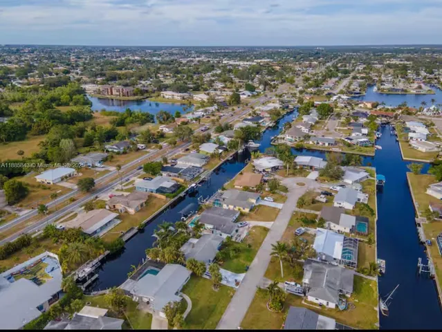 an aerial view of residential building and parking space