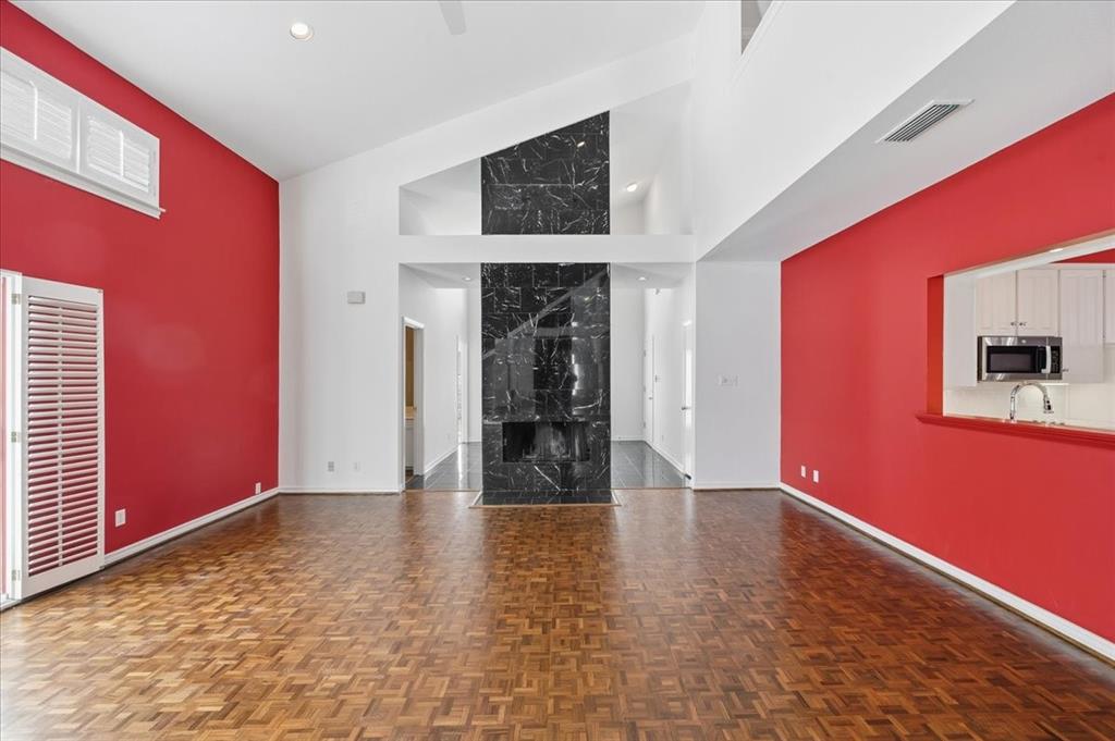 22 1 Main Place Benbrook, TX 76126 - Photo 11 of 40 a view of an empty room with window and wooden floor