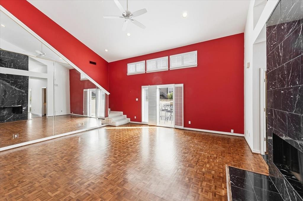 22 1 Main Place Benbrook, TX 76126 - Photo 13 of 40 a view of an empty room with window and wooden floor