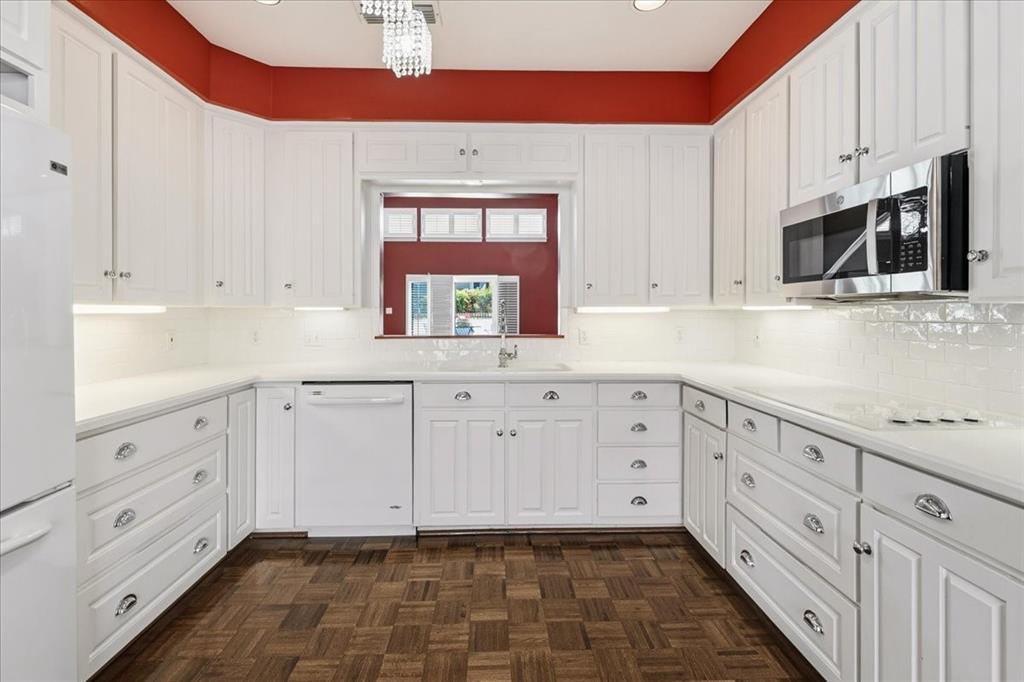 22 1 Main Place Benbrook, TX 76126 - Photo 19 of 40 a kitchen with granite countertop white cabinets stainless steel appliances and sink