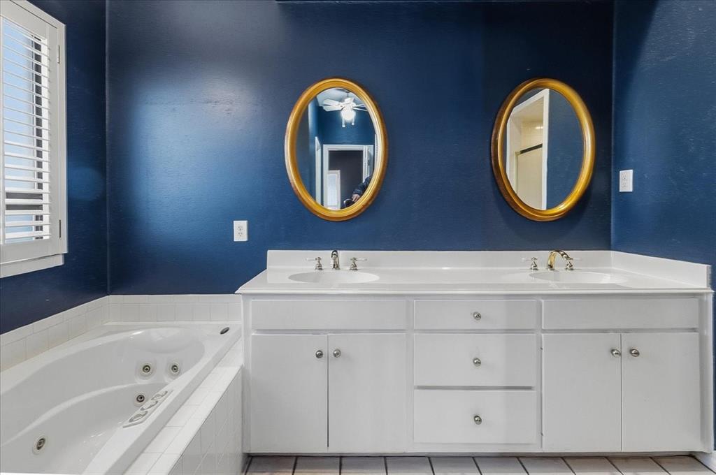 22 1 Main Place Benbrook, TX 76126 - Photo 25 of 40 a bathroom with a sink and a mirror