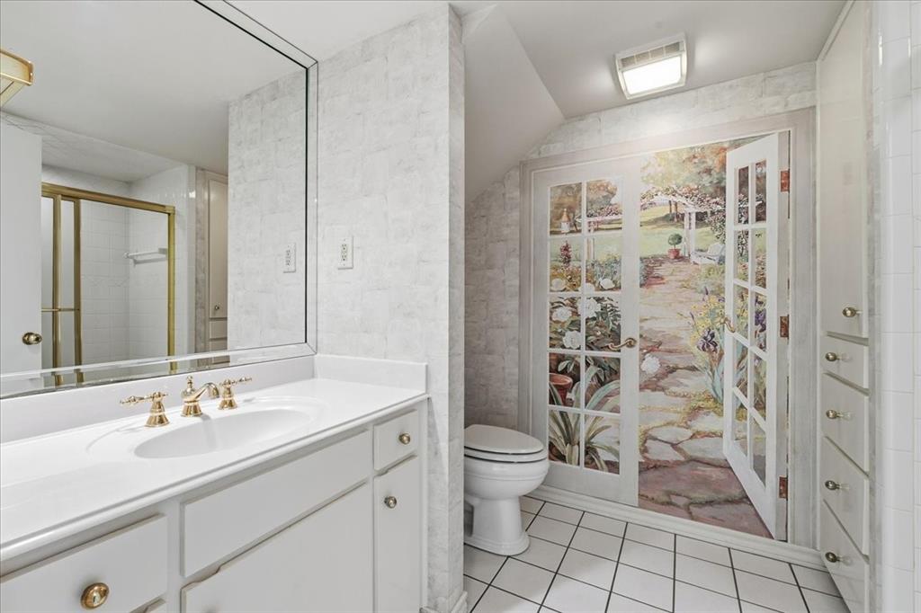 22 1 Main Place Benbrook, TX 76126 - Photo 30 of 40 a bathroom with a double vanity sink toilet and shower