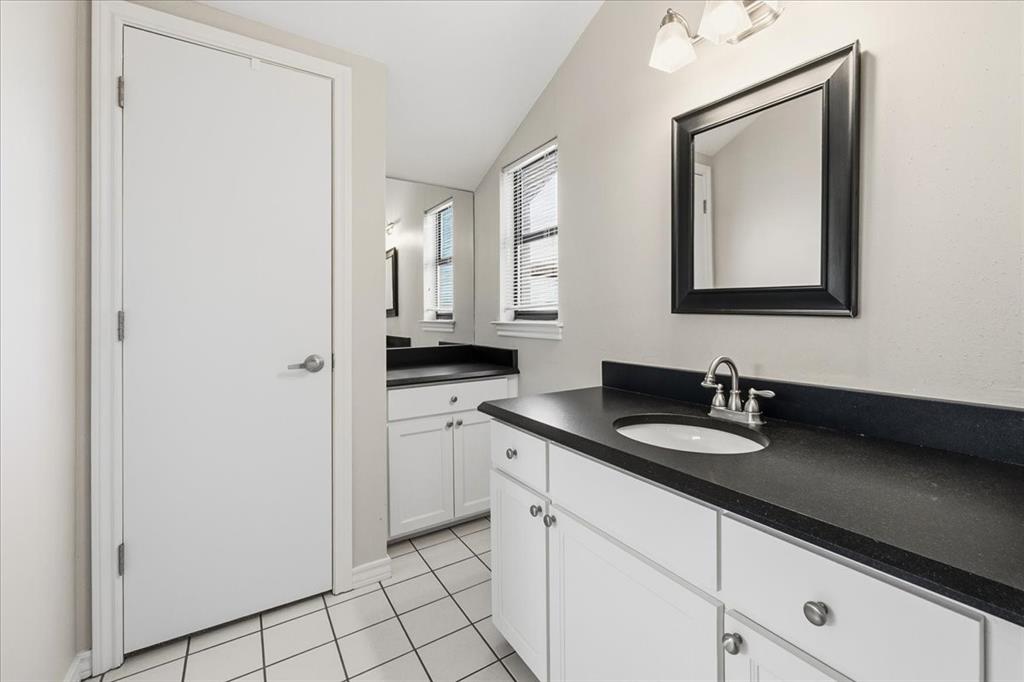 22 1 Main Place Benbrook, TX 76126 - Photo 35 of 40 a bathroom with a sink and a mirror