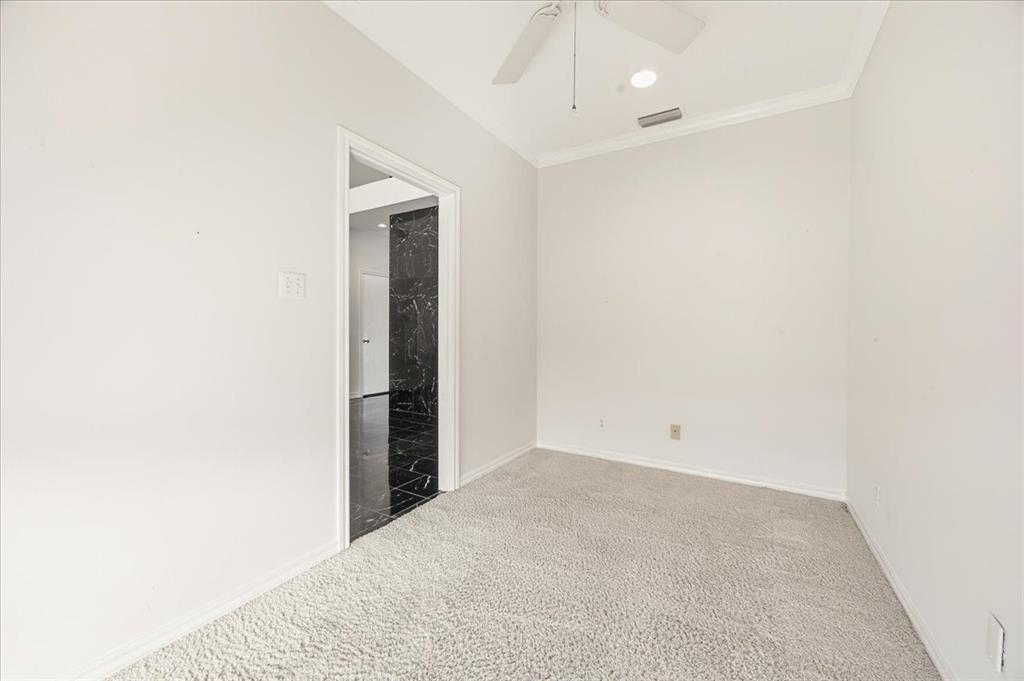 22 1 Main Place Benbrook, TX 76126 - Photo 6 of 40 an empty room with a bathroom and chandelier