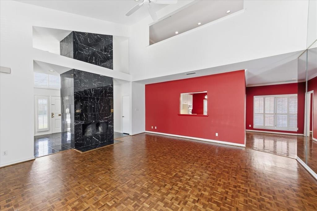 22 1 Main Place Benbrook, TX 76126 - Photo 10 of 40 an empty room with fireplace and windows