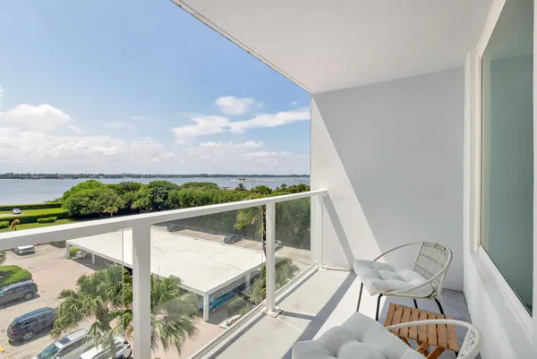 a view of a balcony with furniture