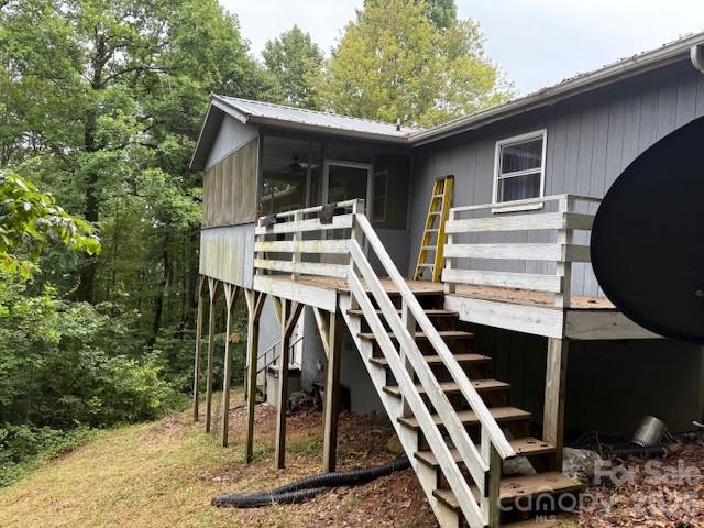 3166 Holly Road Connelly Springs, NC 28612 - Photo 15 of 41 a view of a house with backyard and deck