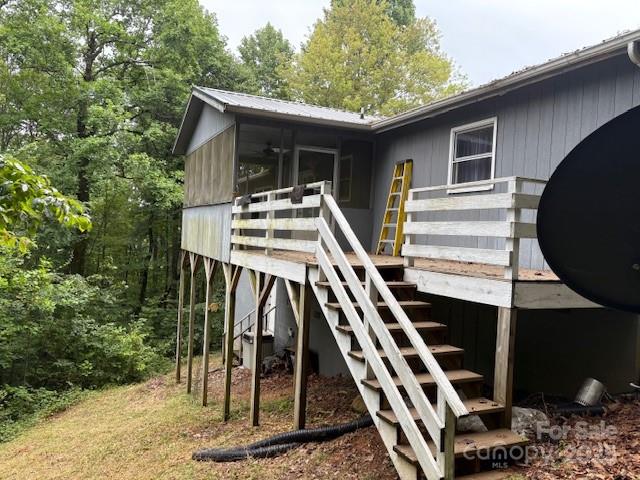 3166 Holly Road Connelly Springs, NC 28612 - Photo 22 of 23 a view of a house with backyard and deck