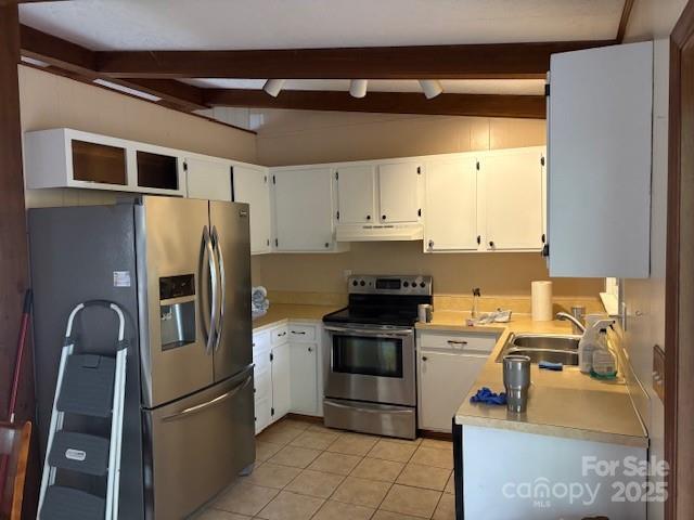 3166 Holly Road Connelly Springs, NC 28612 - Photo 4 of 23 a kitchen with stainless steel appliances a refrigerator sink and cabinets