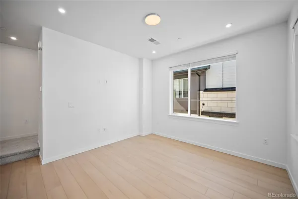 a view of an empty room with a window
