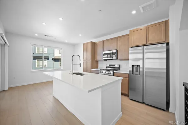 a bedroom with a bed mirror and a window