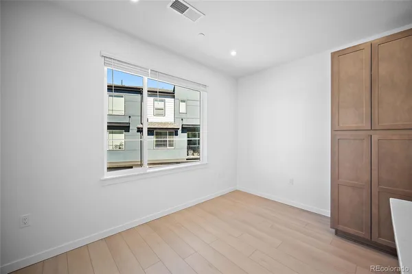 a kitchen with stainless steel appliances granite countertop a stove and a refrigerator