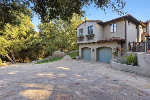 a view of a house with a yard and garage