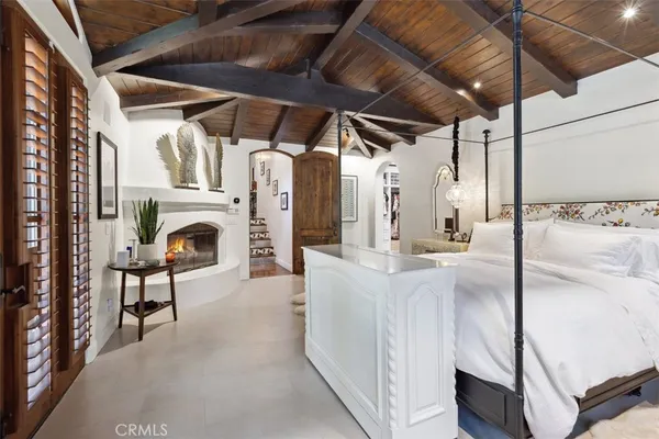 a living room with fireplace furniture and a flat screen tv