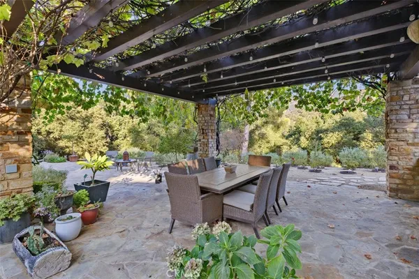 a view of a chairs and tables in the patio