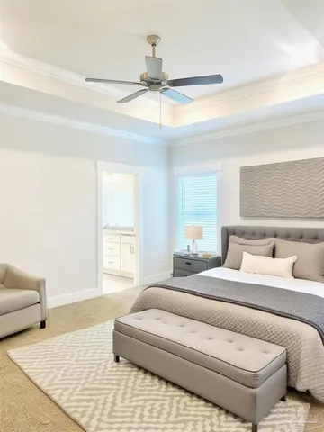 a bedroom with a bed and a couch