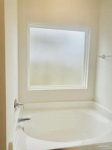 a bathroom with bathtub