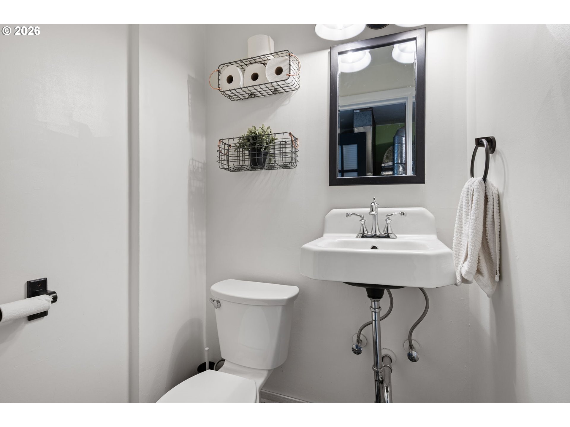 765 Louis Street Eugene, OR 97402 - Photo 28 of 45 a bathroom with a sink toilet and mirror