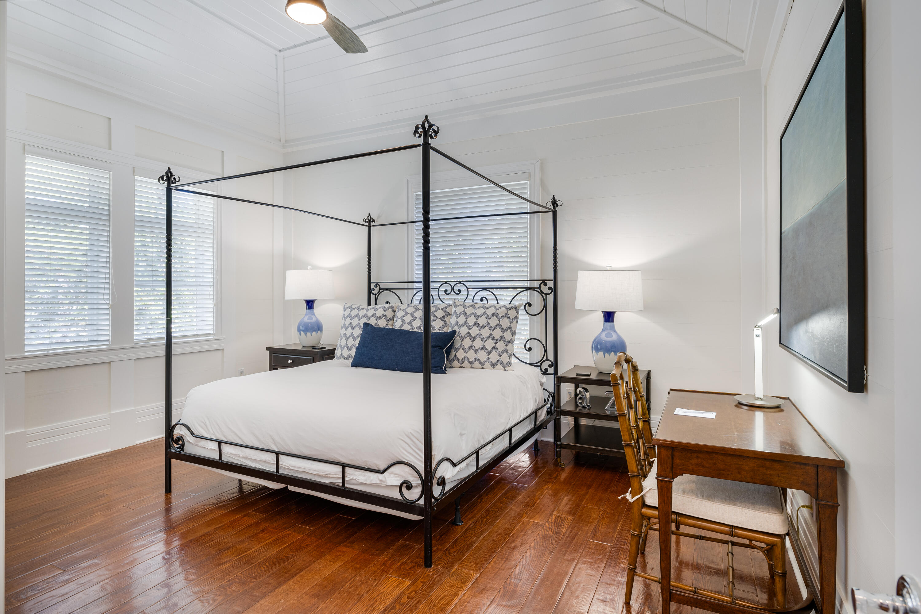 8104 Inspiration Drive, Unit C1 Miramar Beach, FL 32550 - Photo 20 of 29 a bedroom with a bed and wooden floor