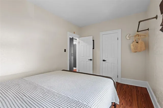 a bedroom with a bed and cabinets